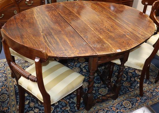 An 18th century oval oak gateleg table on spirla-turned underframe W.146cm extended